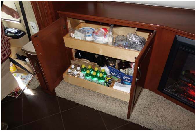 transform-coach-with-fireplace Cabinet with fireplace and plenty of pullout storage