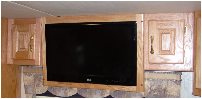 custom-bedroom-rv-cabinet Custom RV bedroom TV cabinet mounted